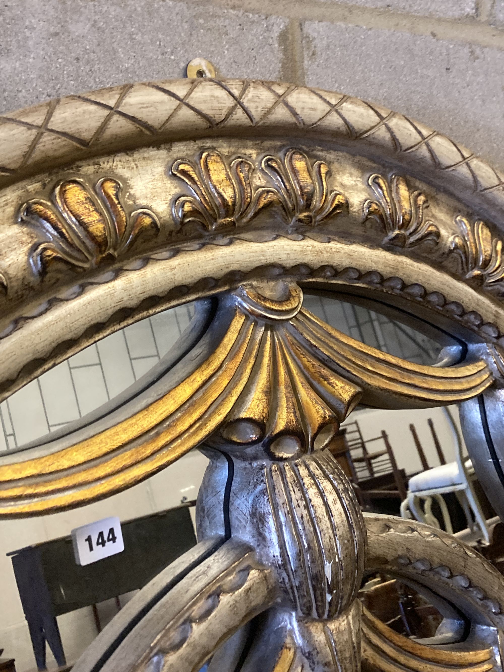 A reproduction parcel gilt arched top wall mirror, width 120cm, height 180cm